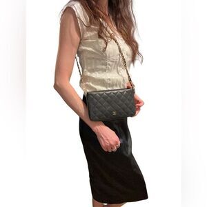 CHANEL Black and Gold Quilted Clutch